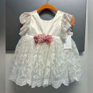NWT brand new Miniclasix 6 mo white lace dress with pink flower detail.